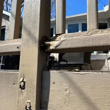 Weathered deck railing connection before repair