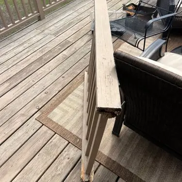 Deck board and railing repair in progress