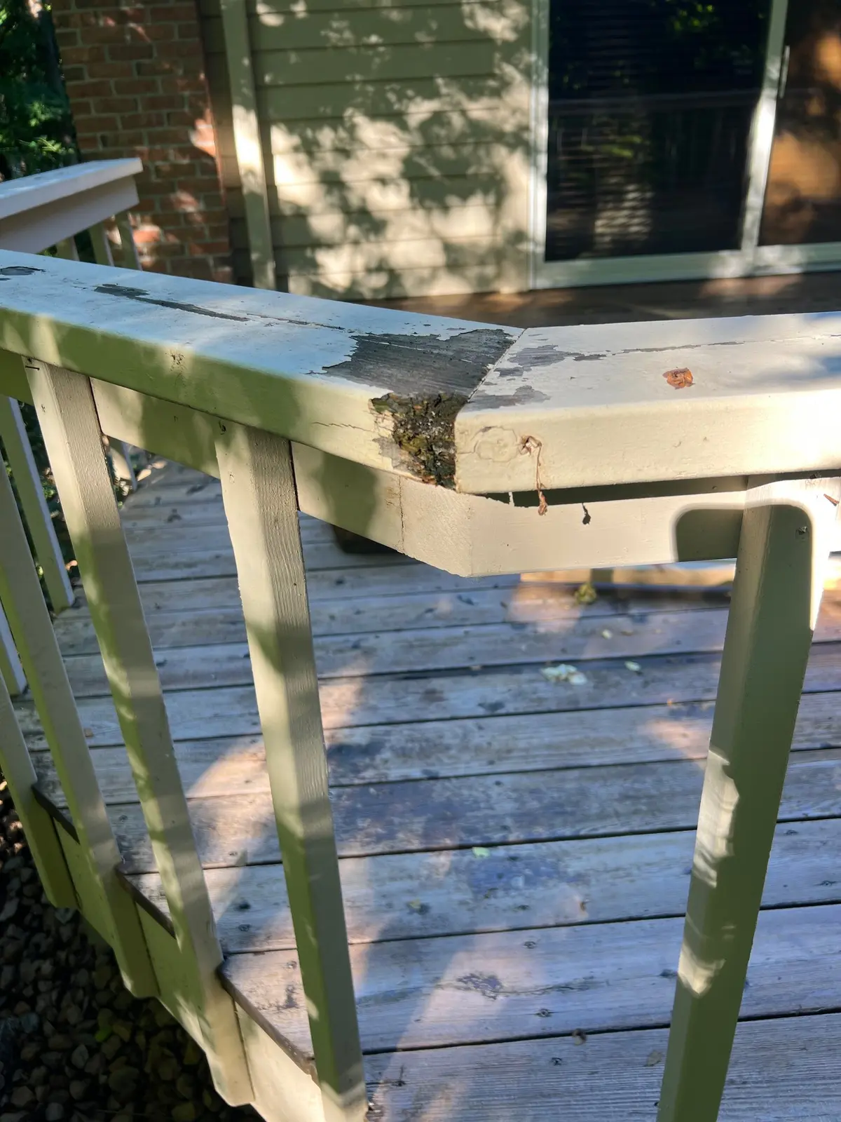 Worn exterior deck corner before repair
